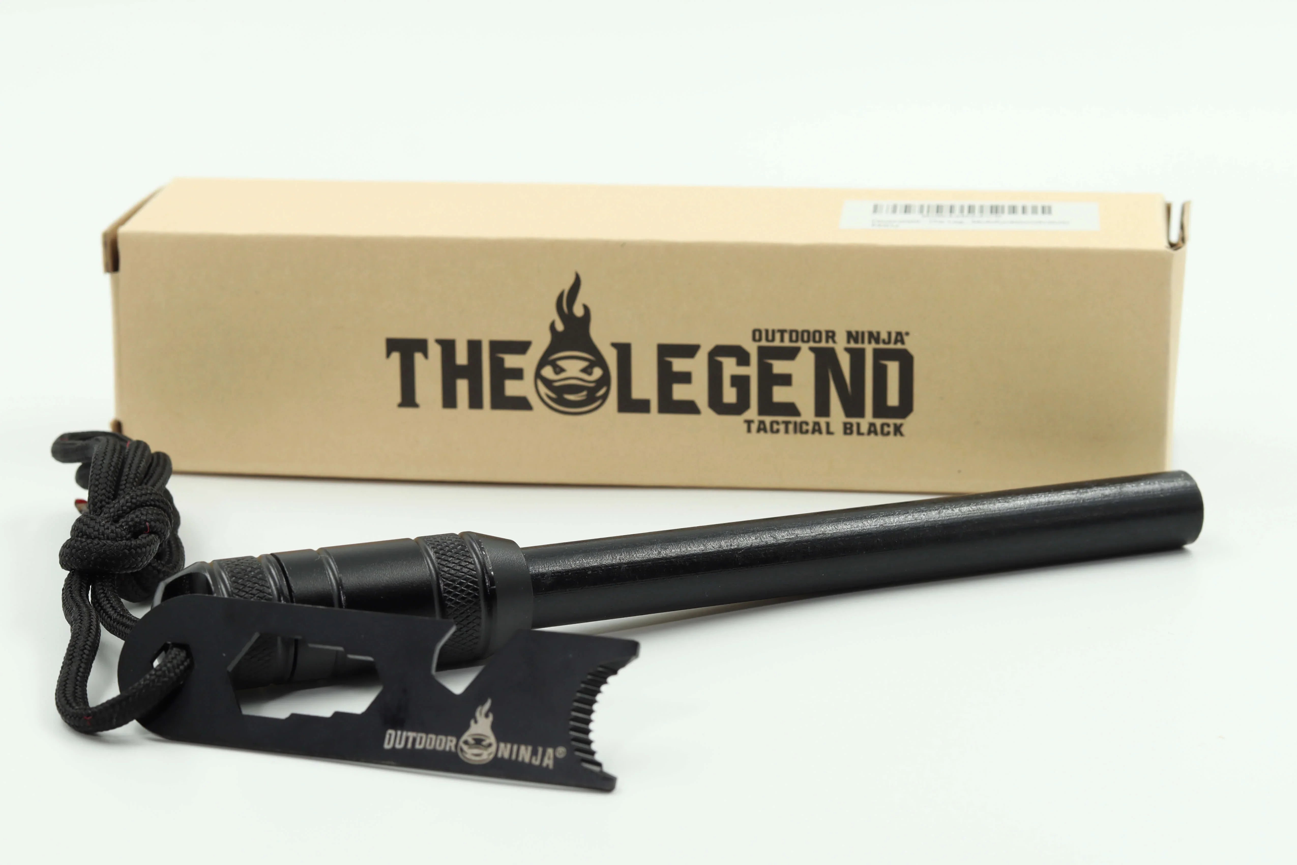Feuerstahl The Legend Tactical schwarz mit Zunderfach, Striker und Paracord Leine vor dem Karton