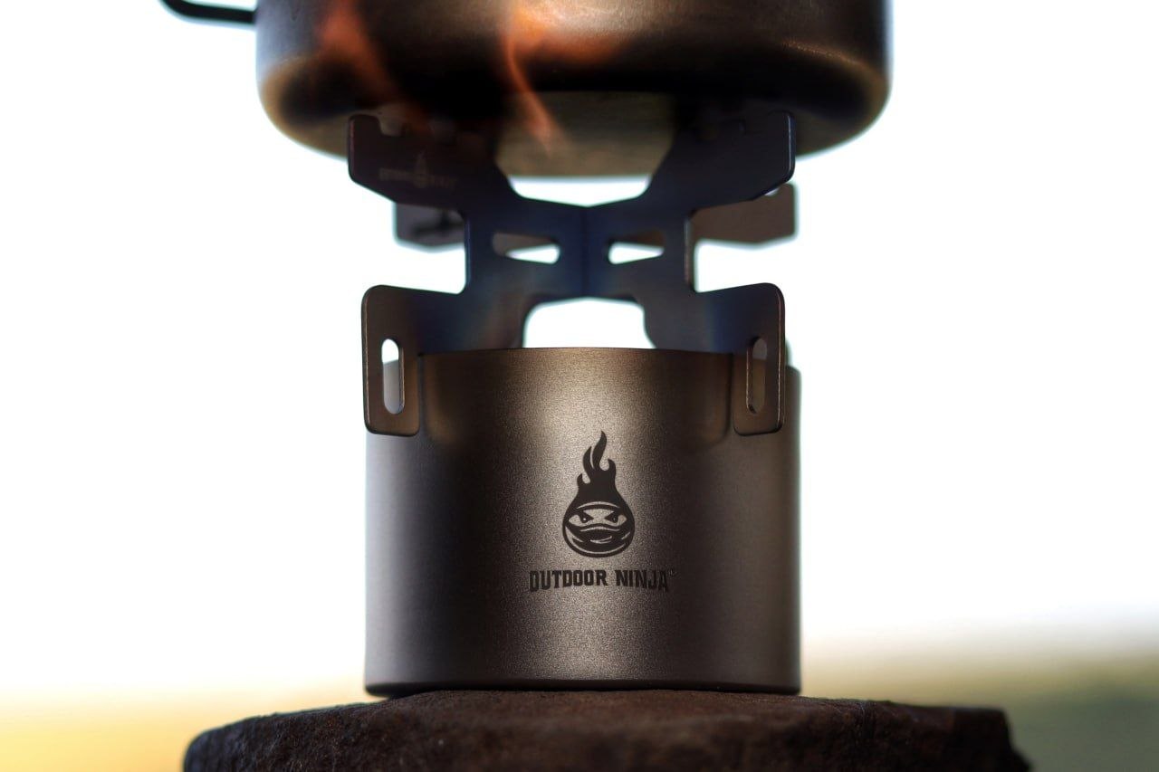 Outdoor Ninja The Burner Mini Titan Spiritusbrenner Ultralight 18g + Topfkreuz und Beutel